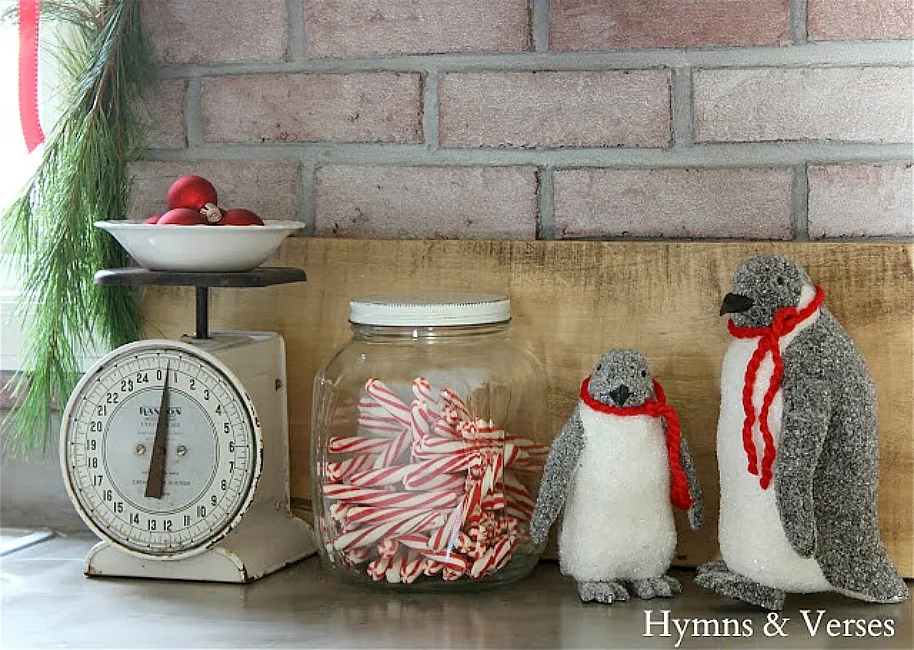 Christmas Vignette with Vintage Scale, Jar of Candy Canes, and Glittery Penguins - Hymns and Verses Blog