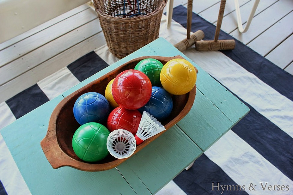 Rugby Stripe Drop Cloth Rug and Vintage Bocce Balls in a dough bowl