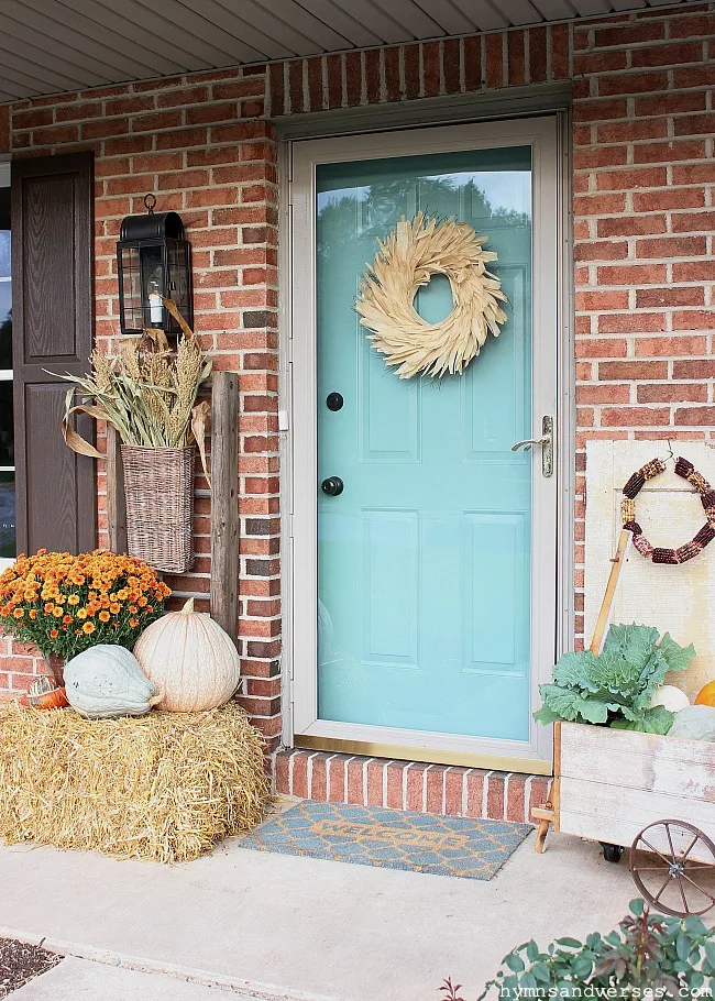 Fall Front Porch with Cornshocks, Mums, Pumpkins, Straw Bale, and Ornamental Cabbage