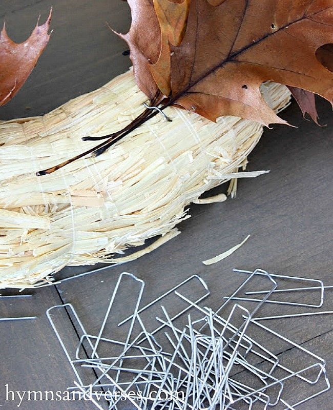 Use floral U pins to attach leaves to straw wreath - Hymns and Verses Blog