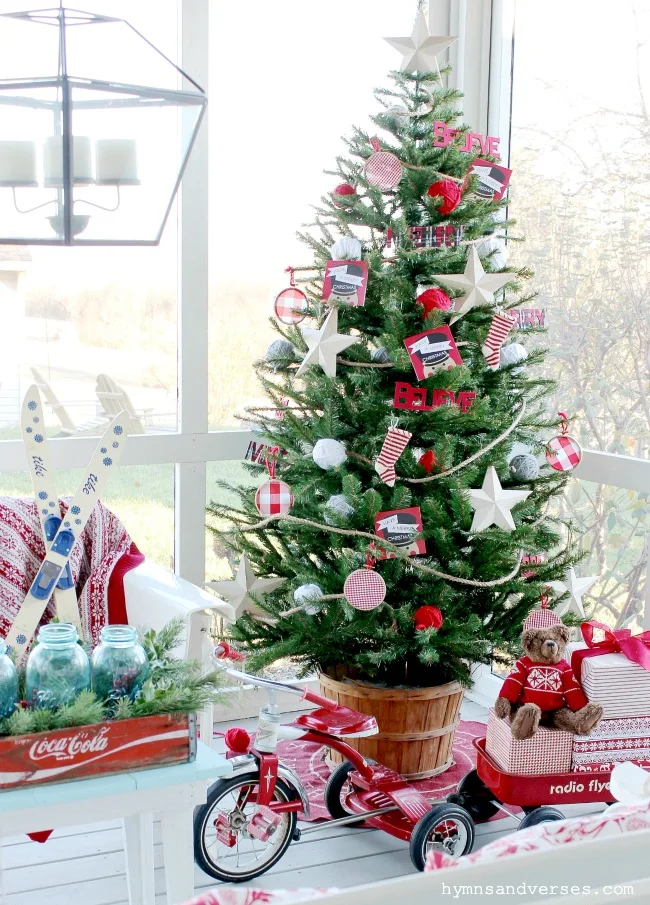 Christmas tree on porch with vintage toys