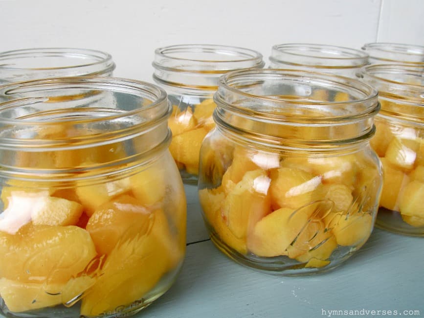 Peaches cut up in Ball jars