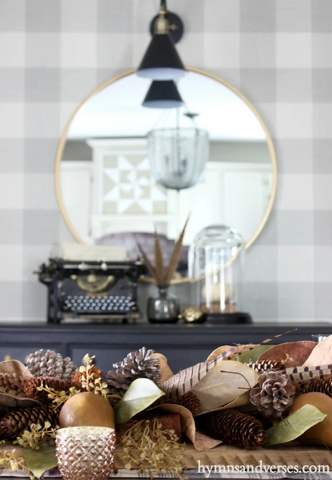 Thanksgiving Centerpiece with Bosc pears, magnolia leaves, pheasant feathers, and pine cones.