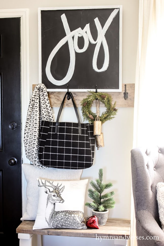 Christmas entryway with black, white and burgundy decor.