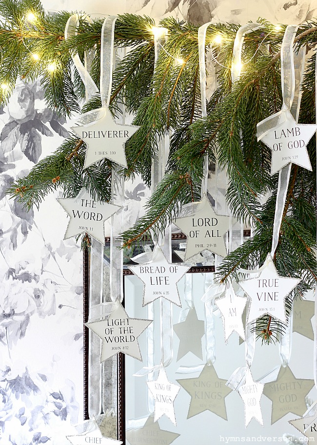 Star Ornaments with Names of Jesus Hanging from Pine Branch - Hymns and Verses