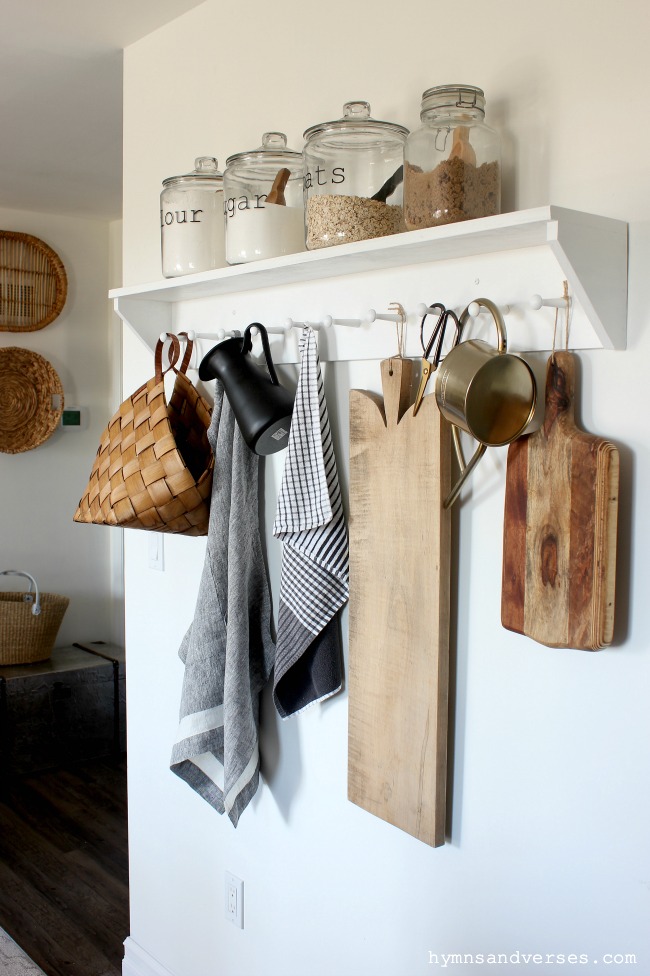 DIY Kitchen Peg Rail Shelf with Cutting Boards, Apron, Basket, and Pitcher