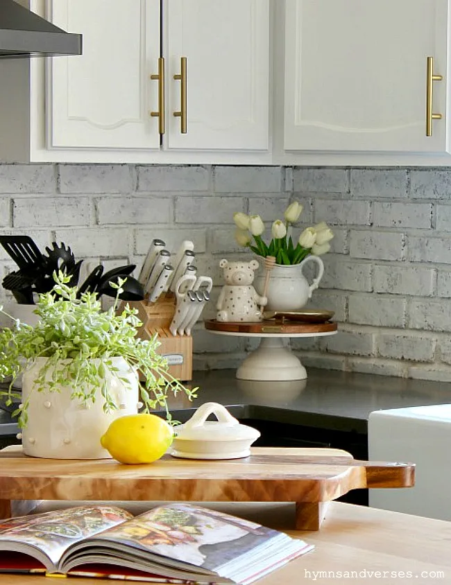 Brass And Walnut Accented Kitchen