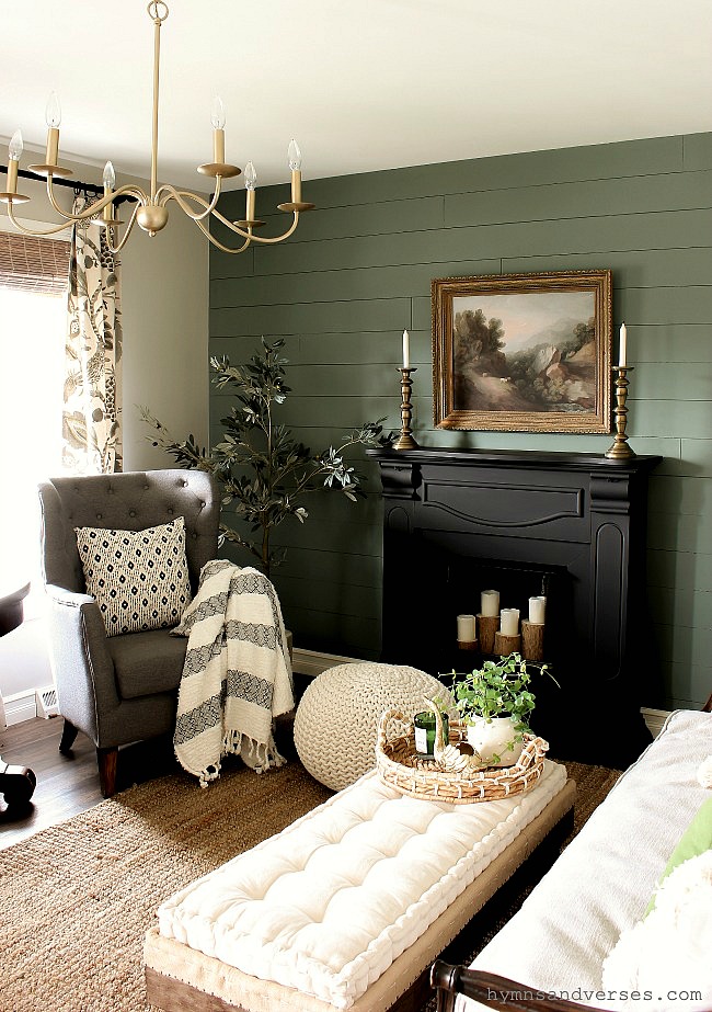 Painted shiplap green accent wall and black mantel - Hymns and Verses