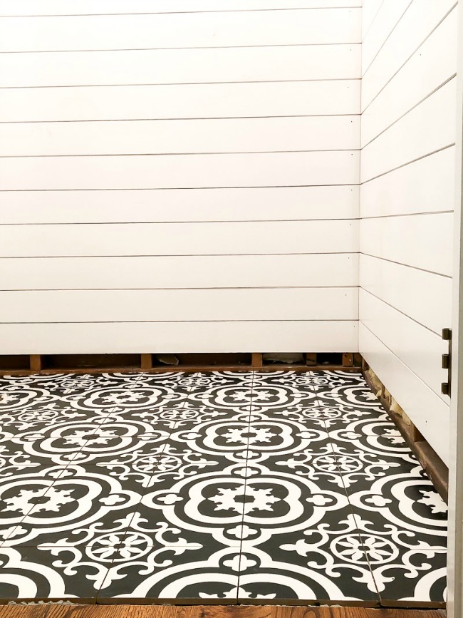 Gorgeous black and white Moroccan tile in bathroom with shiplap walls