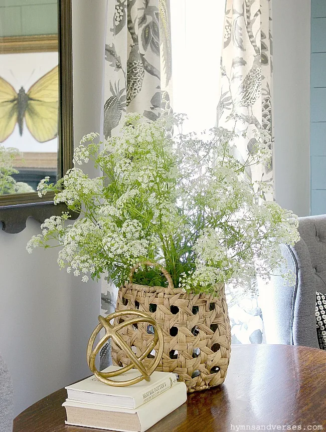 Summer living room with basket of Queen Anne's Lace on the vintage library table - Hymns and Verses Blog