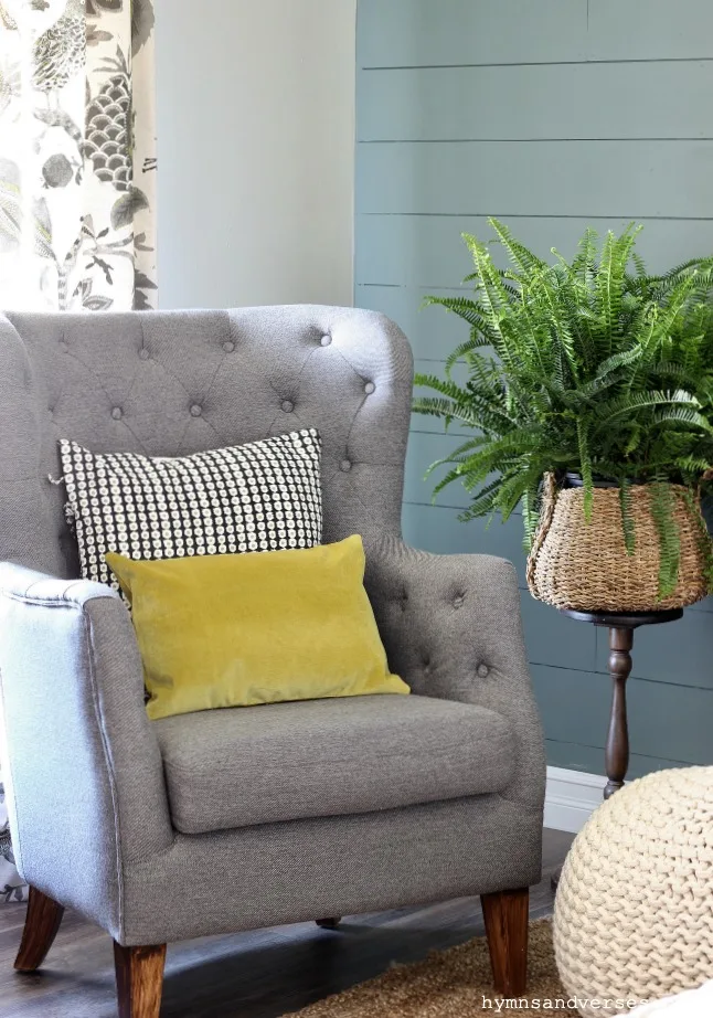 Gray tufted high back chair with black and white and chartreuse accent pillows - Hymns and Verses Blog