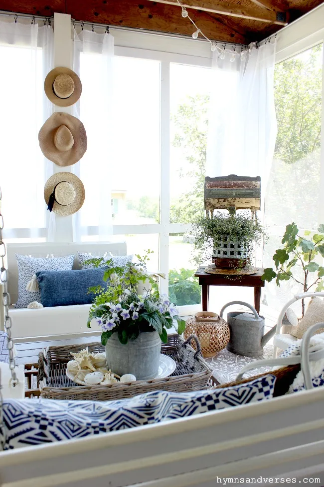 Summer screen porch with vintage elements and blue and white decor - Hymns and Verses Blog