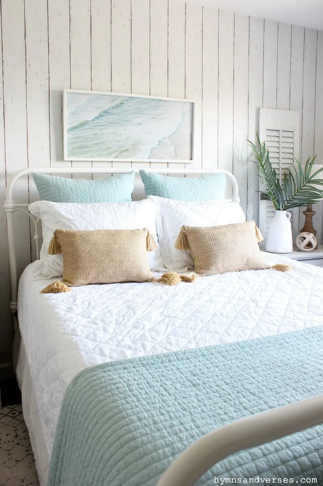 Summer bed with linen and cotton white and aqua quilts and straw lumbar pillows - Hymns and Verses blog