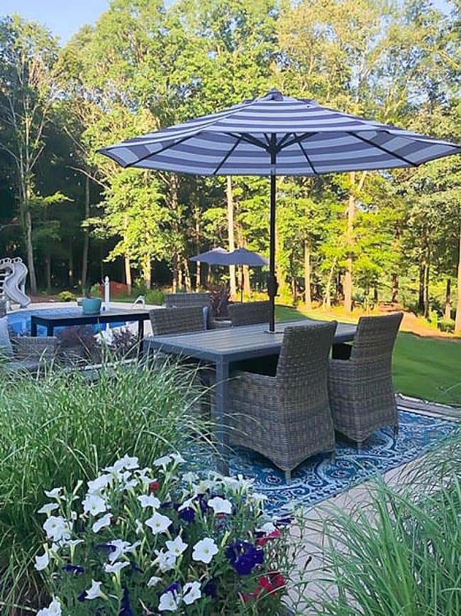 outdoor space with blue and white striped umbrella