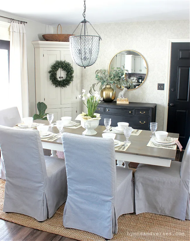 Black, white and gray spring dining room with green accents