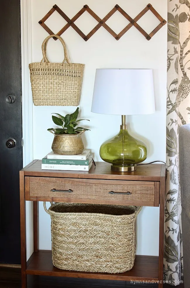 Spring entryway with green glass lamp and baskets
