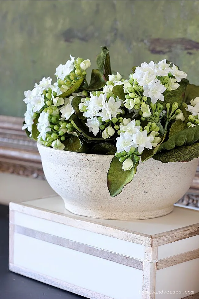 Handmade pottery bowl with white flowers on wood inlaid box