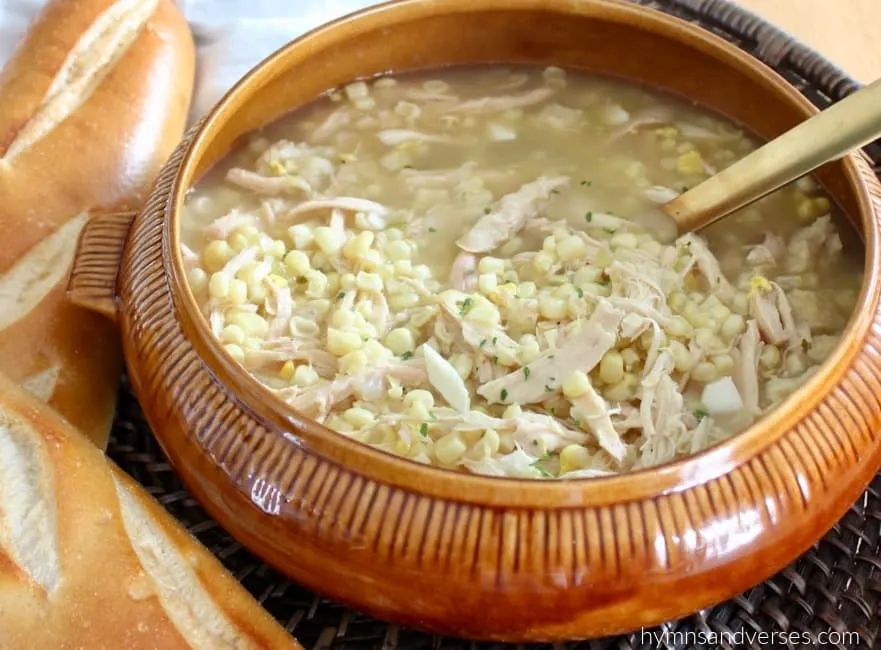 Pot of homemade chicken corn soup with bread