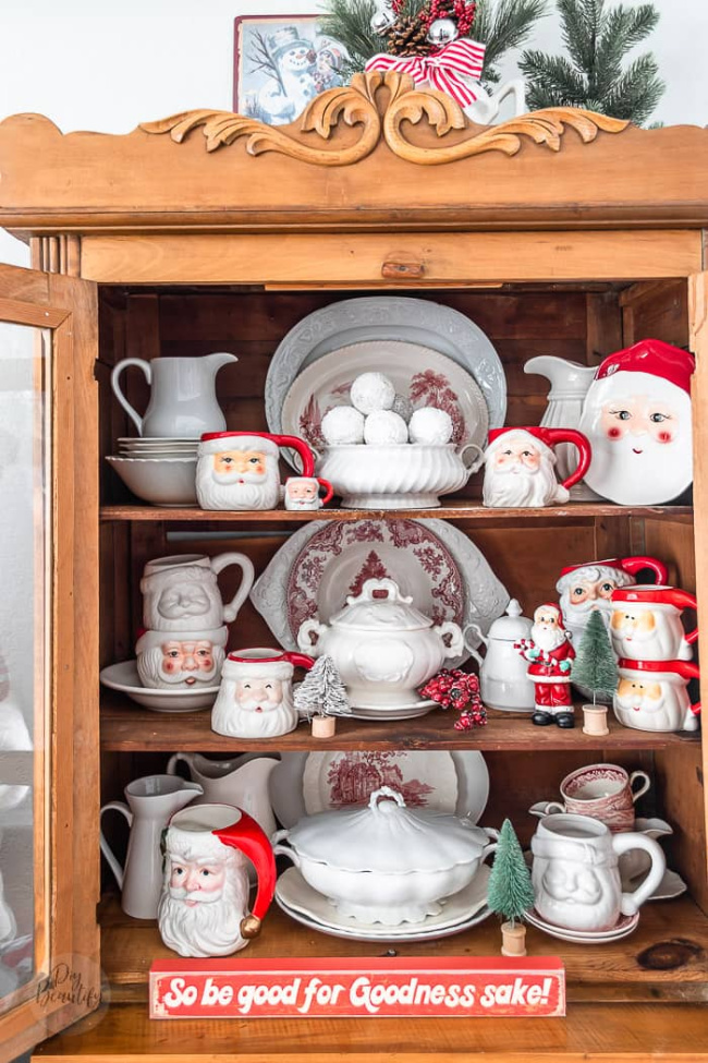 cupboard full of vintage santa decor